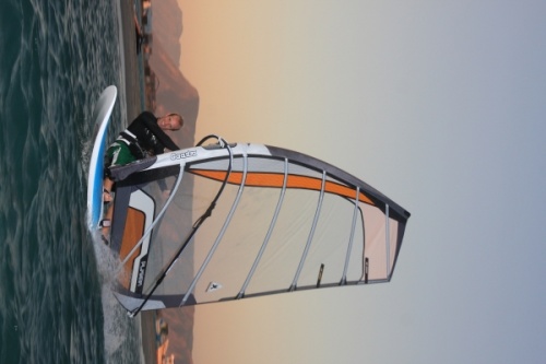 Windsurfing at evening and dusk